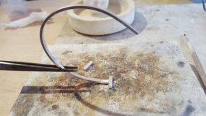 'E' charm and bangle process