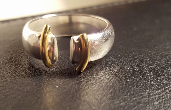 Silver ring with brass detail