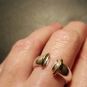 Silver ring with brass detail