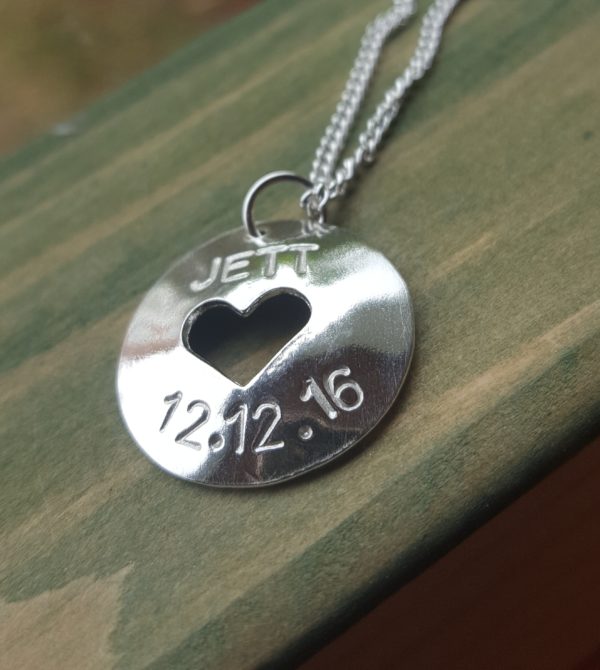 Silver pendant with name and birthday