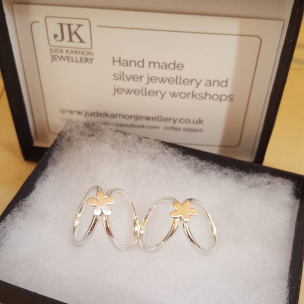 Bespoke handmade silver splint ring with flower design created by Jude Karnon Jewellery