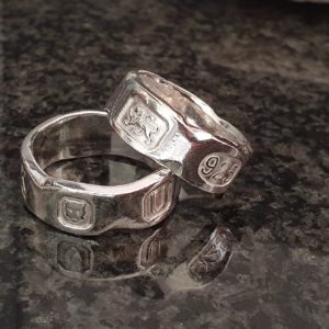 Hallmarked silver rings with a chipped marble effect