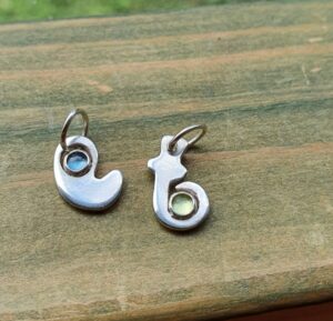 Peridot and topaz initial charm