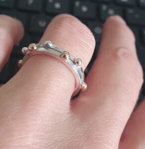 Sterling silver and rose gold studded rings