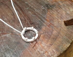 Battle pendant with ball detail