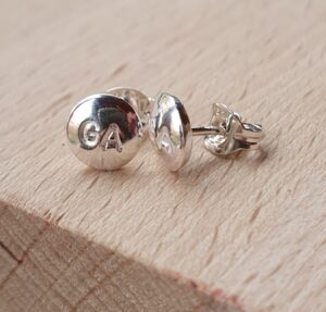 Netball earrings with netball positions