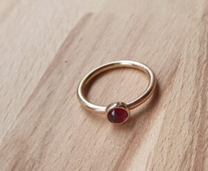 Garnet and rose gold ring