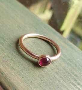Garnet and rose gold ring