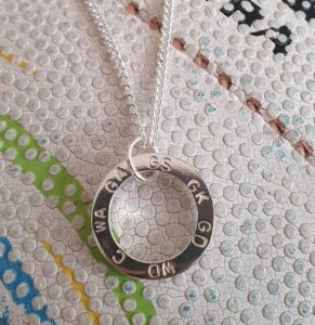 Spinning netball pendant.