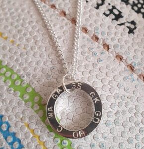 Spinning netball pendant.