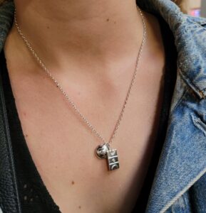 Netball court and netball ball charm on a necklace