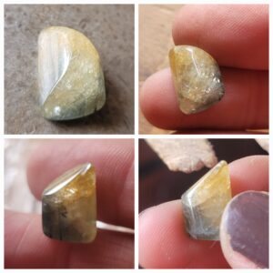 Rough sapphire in prong setting pendant.