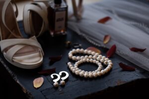 The wedding accessories. The pearl earrings to go with her pearl necklace.