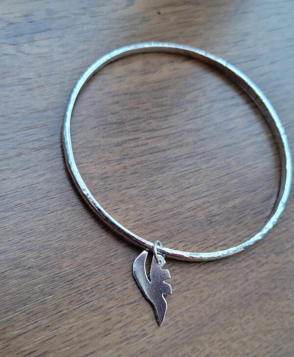 Silver bangle with leaf charm made in my bangle workshop.