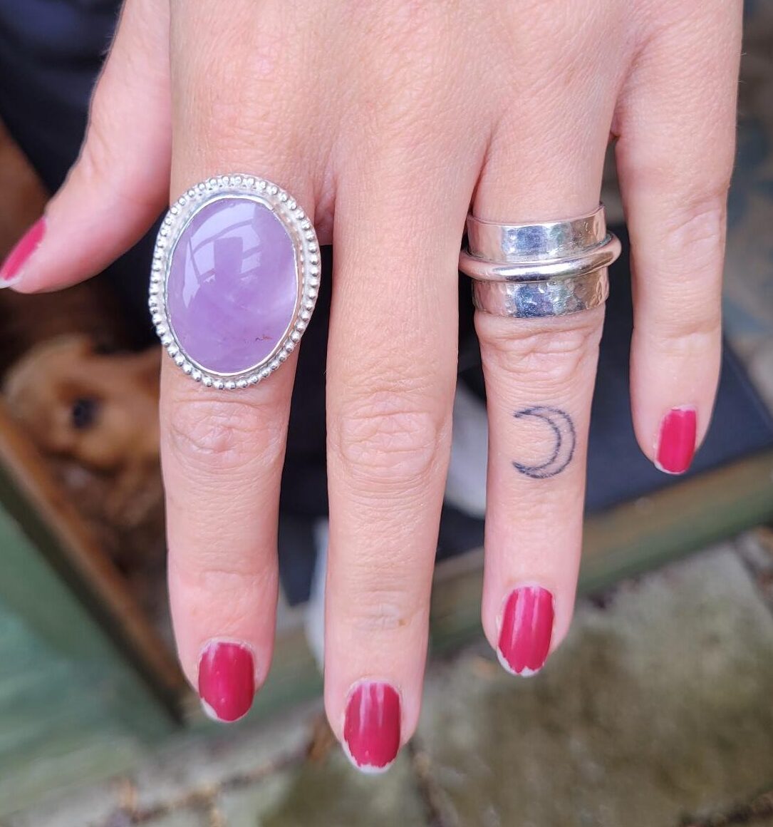 Rose quartz gemstone set in a ring in my gem stone workshop.