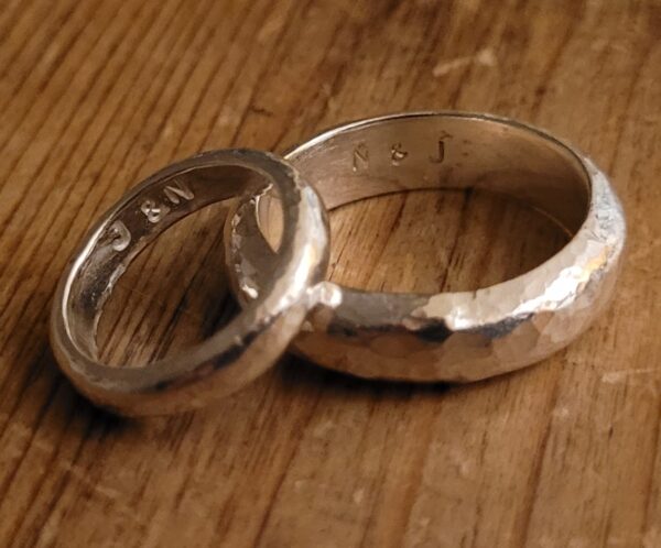 Silver wedding rings made at a wedding ring workshop.