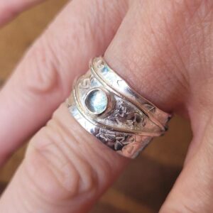 Aquamarine set in a wide ring with copper detail made in my gem setting workshop.