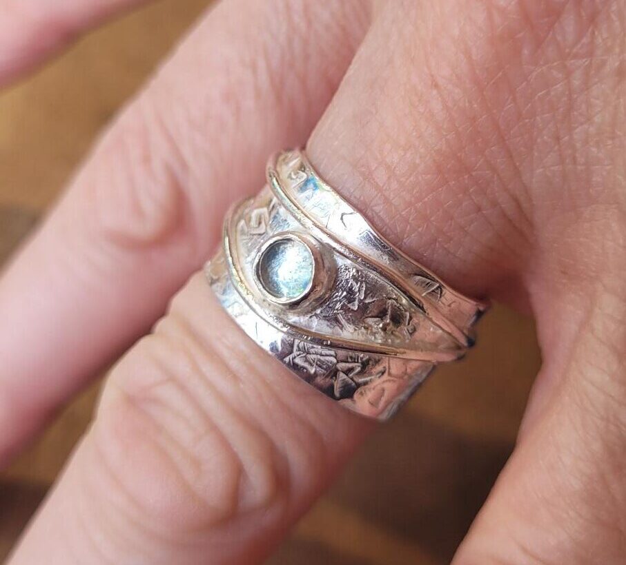 Aquamarine set in a wide ring with copper detail made in my gem setting workshop.