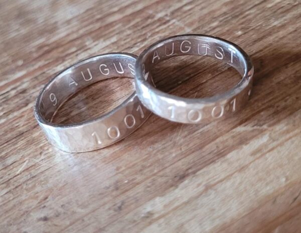 Silver wedding rings made at a wedding ring workshop.