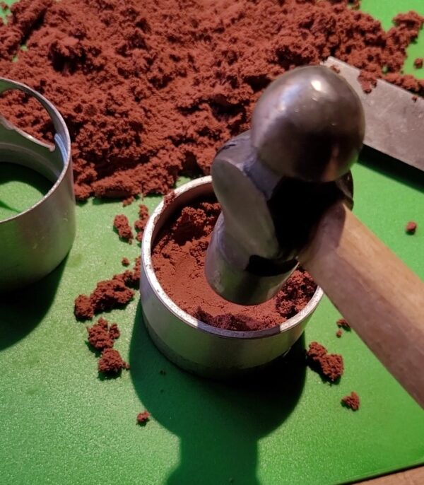 Using Delft clay in a flask to sand cast a ring.