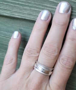 Sterling silver netball themed fidget spinner ring.