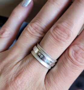 Sterling silver netball themed fidget spinner ring.