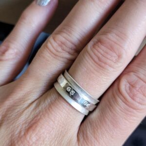Sterling silver netball themed fidget spinner ring.