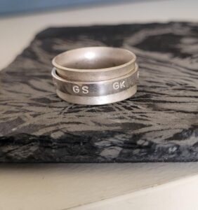 Sterling silver netball themed fidget spinner ring.